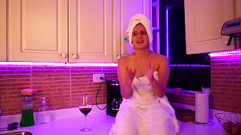 This girl masturbates in kitchen