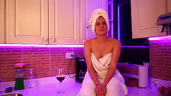 This girl masturbates in kitchen