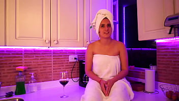 This girl masturbates in kitchen