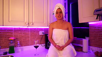 This girl masturbates in kitchen