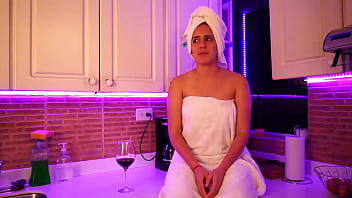 This girl masturbates in kitchen