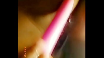 Playing with a dildo