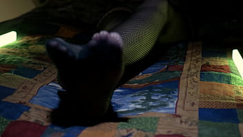 Perfect toes peeking through sexy fishnets