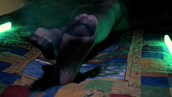 Perfect toes peeking through sexy fishnets