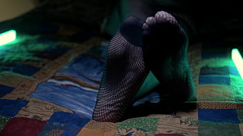 Perfect toes peeking through sexy fishnets