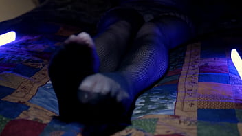 Perfect toes peeking through sexy fishnets