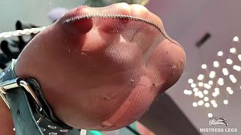 My foot in torn tan tights wiggling right above your face