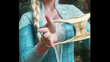 She's unraveling the chill with a playful tug where braids meet bold frozen fortress—this elsa beckons from the edge of enchanted edges