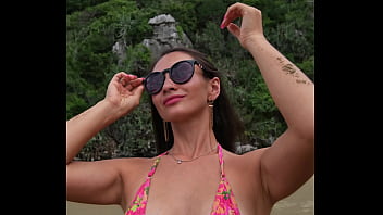 Sexy mini bikini flashing on the tropical beach