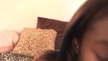 Pierced ebony teen girl enjoying the white meat