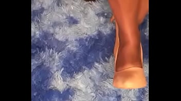 She is playing and teasing with her black bare feet