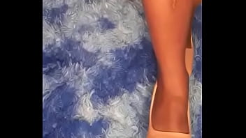 She is playing and teasing with her black bare feet