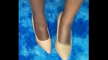 She is playing and teasing with her black bare feet