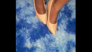 She is playing and teasing with her black bare feet