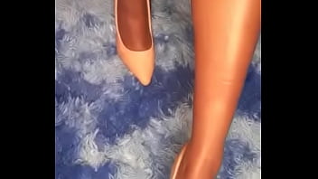 She is playing and teasing with her black bare feet