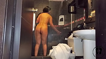 Latin hot milf piss in the shower putting thing up her pussy