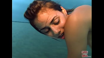 Petite brunette pleasure herself on a boat