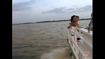 Petite brunette pleasure herself on a boat