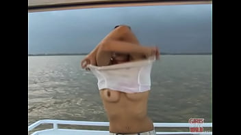 Petite brunette pleasure herself on a boat