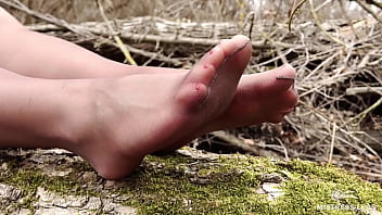 Cute soles and toes in tan tights outdoor