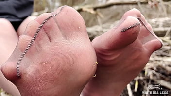Cute soles and toes in tan tights outdoor