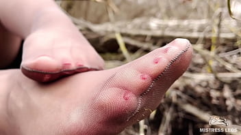 Cute soles and toes in tan tights outdoor