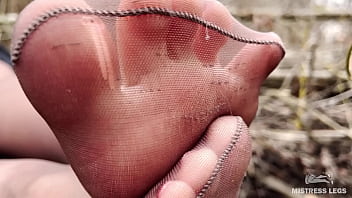 Cute soles and toes in tan tights outdoor