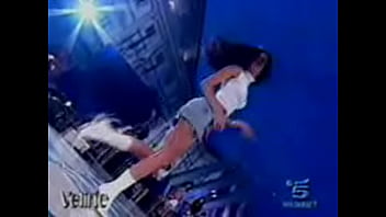 Hot italian beauty shows upskirt as she dances during a performance