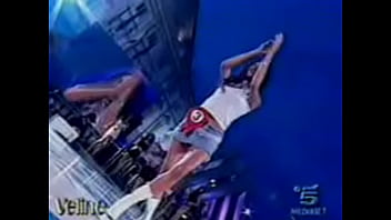 Hot italian beauty shows upskirt as she dances during a performance