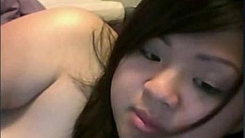 Asian girl plays with tight pussy on cam