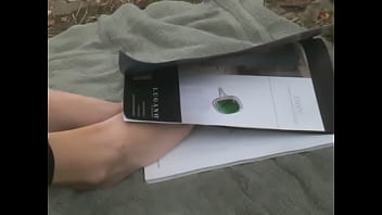 Flipping through magazine with feet