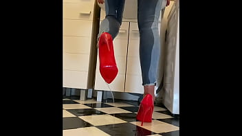Wetting extremely jeans and red classic high heels and play with pee