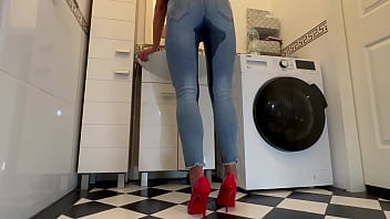 Wetting extremely jeans and red classic high heels and play with pee