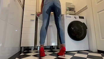 Wetting extremely jeans and red classic high heels and play with pee