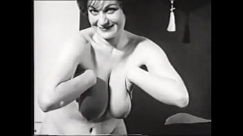 Naughty curvy brunette gets naked on camera in 60s clip