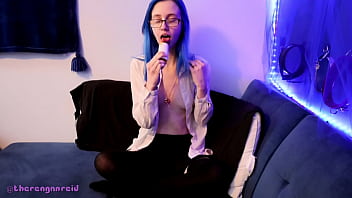 Emo punk girl sucks on a popsicle