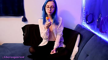 Emo punk girl sucks on a popsicle