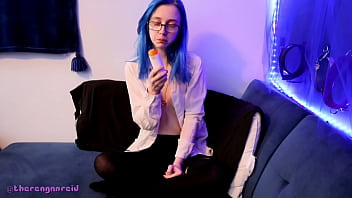 Emo punk girl sucks on a popsicle