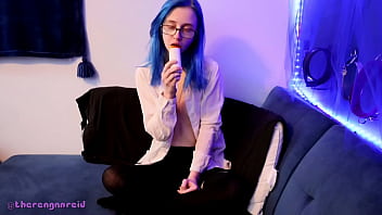 Emo punk girl sucks on a popsicle