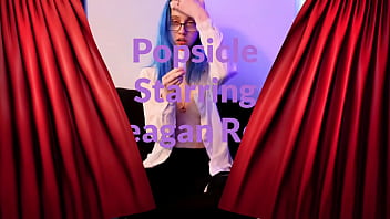 Emo punk girl sucks on a popsicle