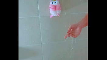 Stunning tanned babe showers off after a wet poolside escape