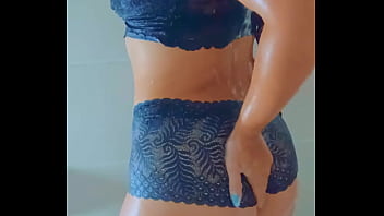 Stunning tanned babe showers off after a wet poolside escape