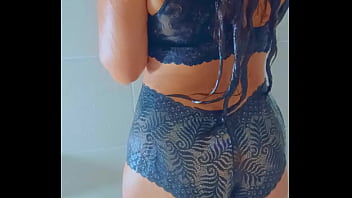 Stunning tanned babe showers off after a wet poolside escape