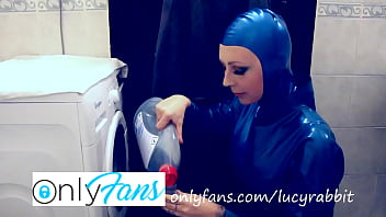 Let's wash laundry dressed in blue latex catsuit