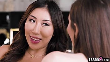 Asian lesbian milf gets a strapon dildo right up her asshole from her dominant friend