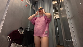 Daring fitting room try on with the curtain left open in public