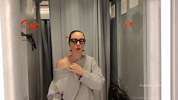 Daring fitting room try on with the curtain left open in public