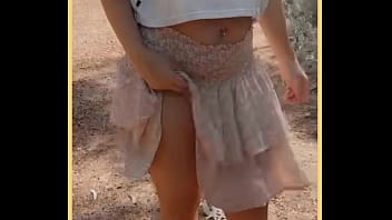 Milf shows her shaved pussy in public