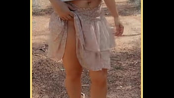 Milf shows her shaved pussy in public