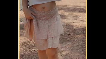 Milf shows her shaved pussy in public